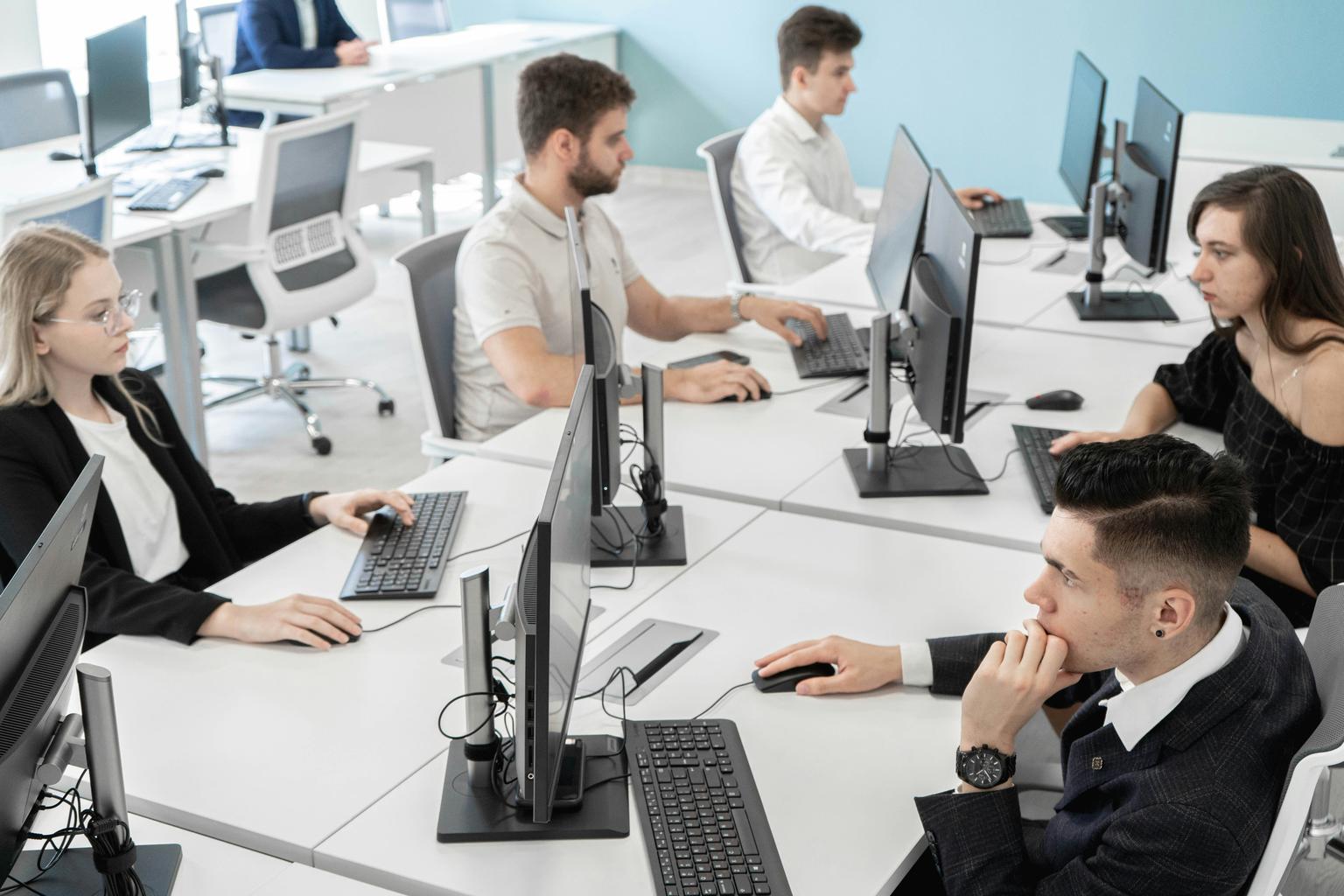 Office operations and technology illustrating finance outsourcing, IT, and facilities support